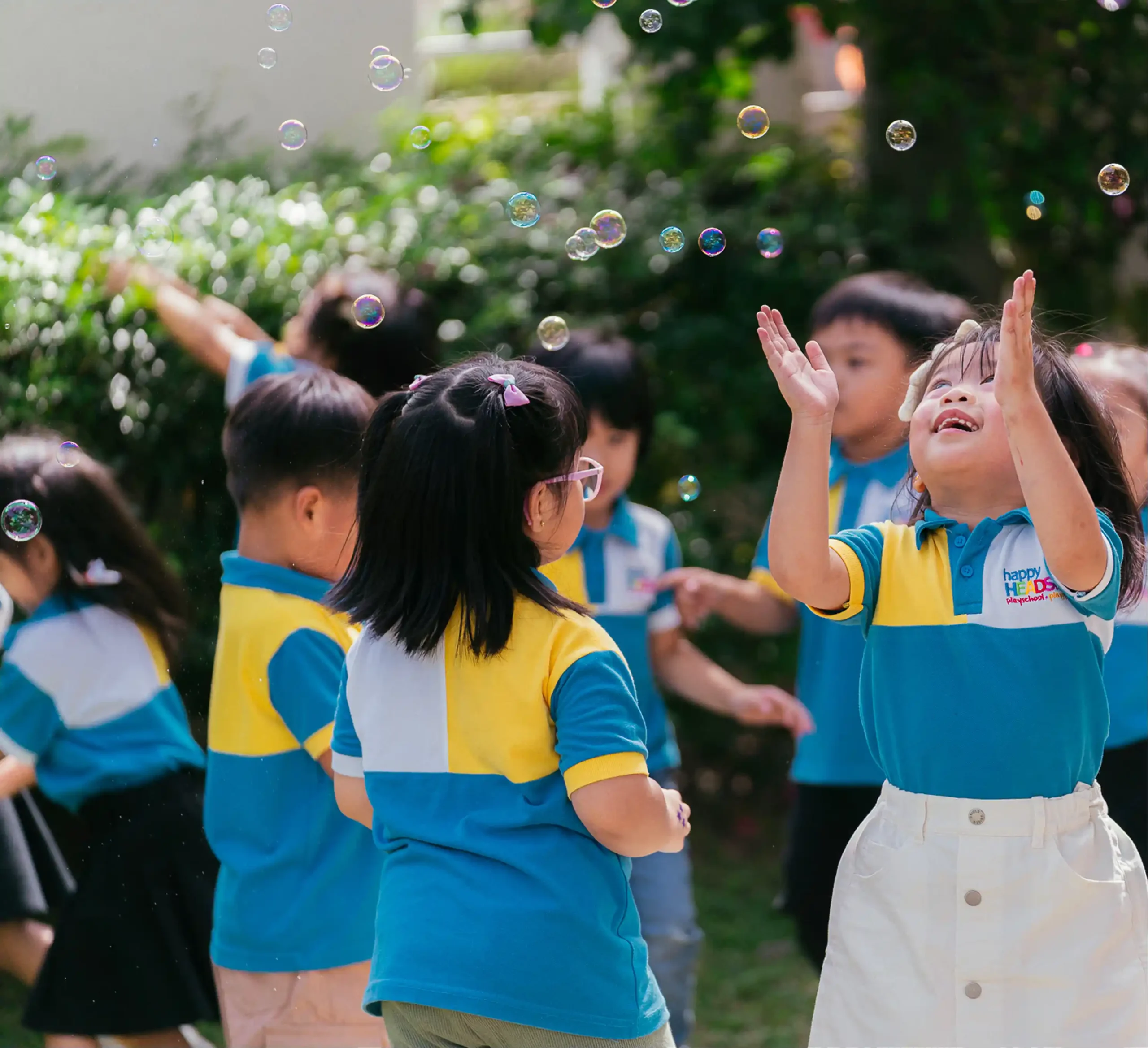 Happy Head Start students engaged in outdoor activities